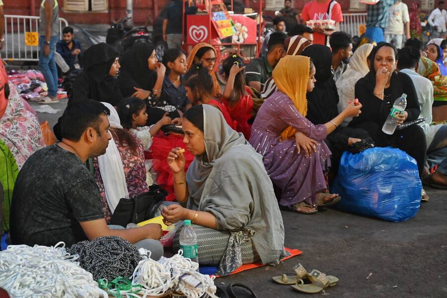 People break their fast for Iftar at New Market at New Market on the last day of Ramzan