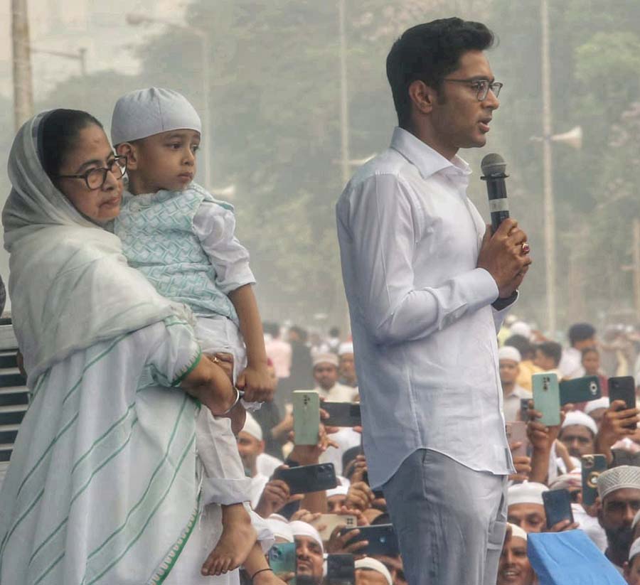 Chief minister Mamata Banerjee and (right) her nephew Abhishek Banerjee attended the Eid-ul-Fitr prayers at Red Road on Thursday