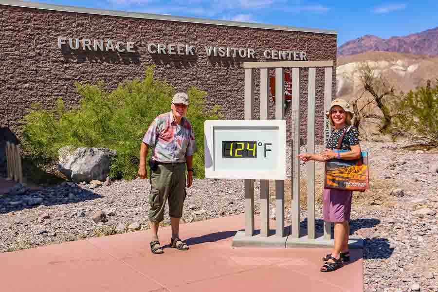 Tourists at the famous thermometer at Furnace Creek in Death Valley, which shows over 120°F