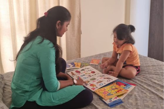Farheen giving tuition to a child in her neighbourhood. 