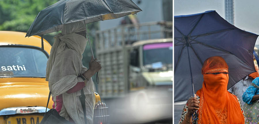 The India Meteorological Department (IMD) has suggested precautionary measures like covering oneself with a cloth, hat or an umbrella. In picture, a woman uses a dupatta and an umbrella as  sunscreens  