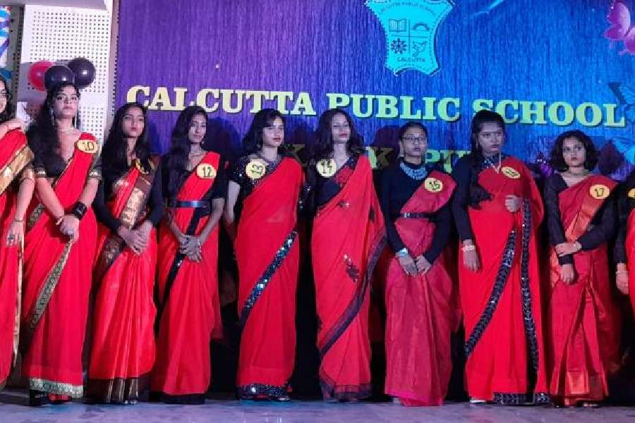 Girls of Calcutta Public School, Kalikapur in red decked up for the ramp.