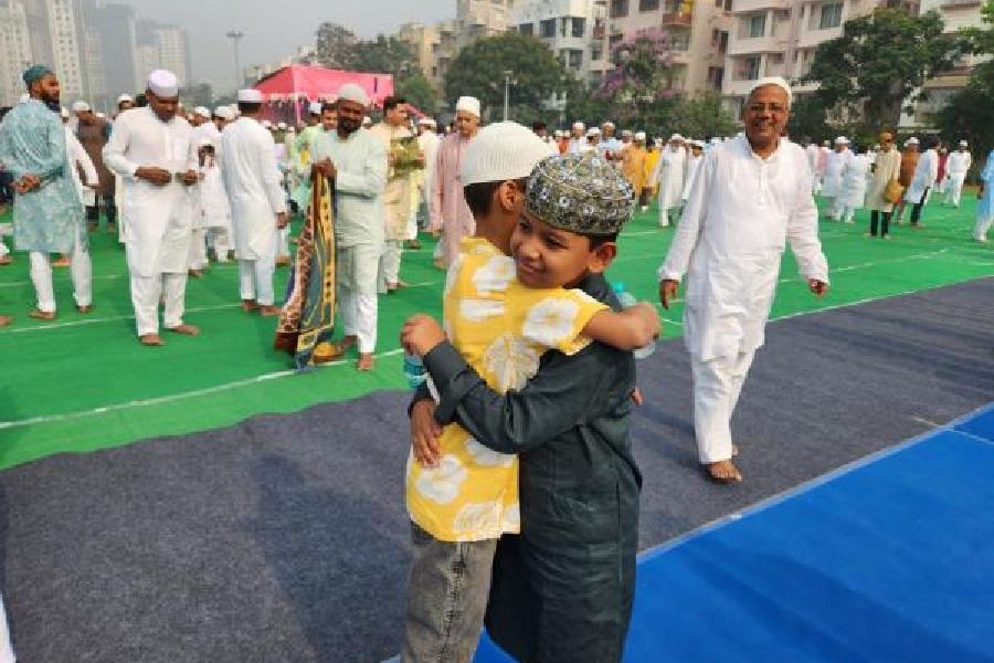 Boys embrace after namaz at New Town