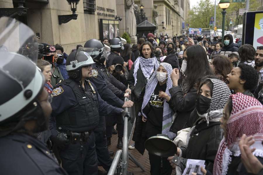 Pro-Palestinian protesters and police officers outside of Columbia University in New York, on Thursday afternoon, April 18, 2024.