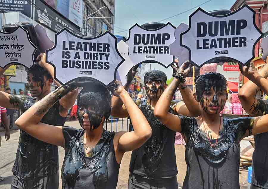 Ahead of Earth Day, which is on April 22, members of People for the Ethical Treatment of Animals (PETA) and Animal allies doused themselves with sludge and campaigned against toxic leather in the New Market area on Friday  