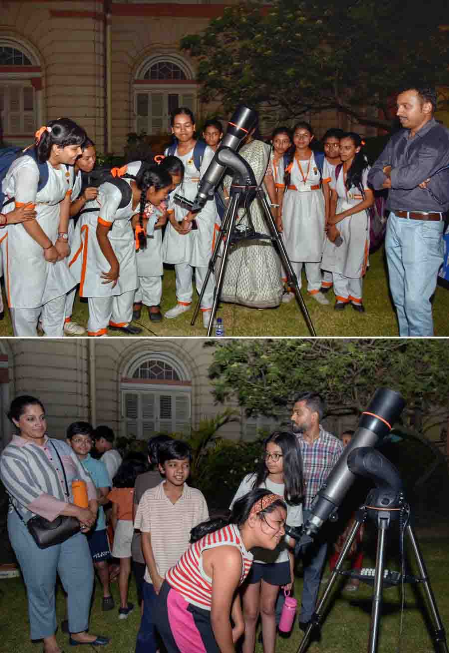 Schoolchildren and other guests take chances at the scientific telescope under the guidance of BITM staff