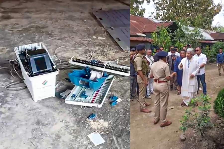 A broken EVM at a polling booth after incidents of violence during the first phase ofLok Sabha polls in Manipur’s West Imphal on Friday, and (right) a Congress candidate and security personnel get into a spat in Keirao during polling.