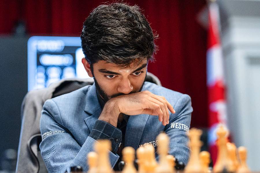 MIND GAMES: Grandmaster D. Gukesh of India immersed in the game during his Round 14 match against Grandmaster Hikaru Nakamura of the US at the Fide Candidates 2024 chess tournament in Toronto on Sunday. Gukesh played out a draw with Nakamura to emerge champion of the tournament and become the youngest-ever challenger to the world title, for which he will face Chinese GM Ding Liren.