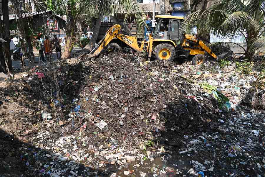 Garbage being removed from the pond in Jadavpur on Wednesday.