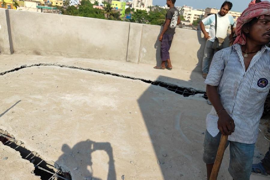 The demolition team pulls down a portion of the top floor of the illegal building in Kasba on Wednesday.