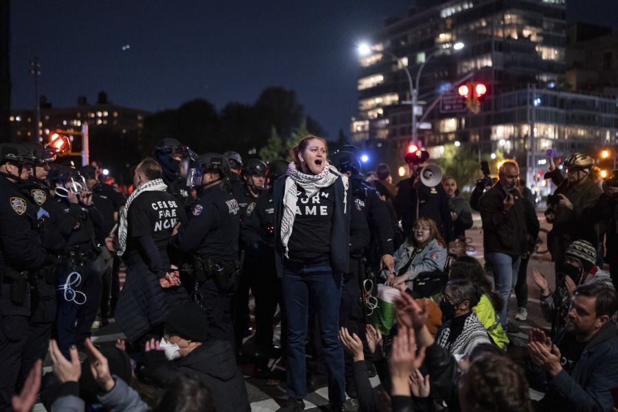 NYPD officers arrest members of Jewish Voice for Peace who had blocked an intersection in the Brooklyn borough of New York on Tuesday, April 23, 2024.