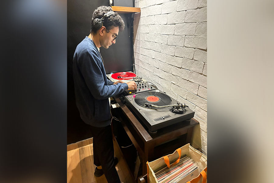 Musician Jivraj Singh spins a disc on Vinyl Sundays at Zee's Coffee Shop