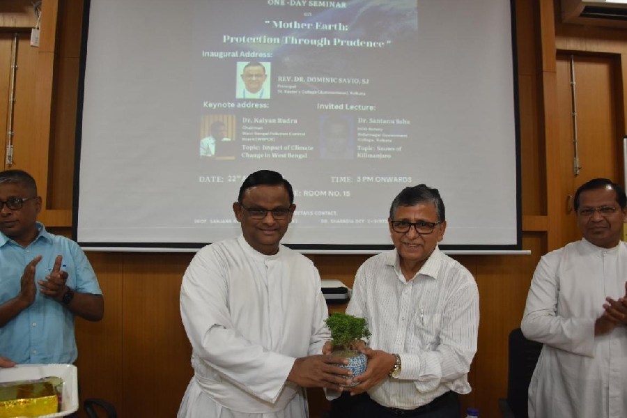 Kalyan Rudra, the chairperson of the West Bengal Pollution Control Board, being greeted by (left) Father Dominic Savio, the principal of St Xavier’s College, during the seminar on April 22.