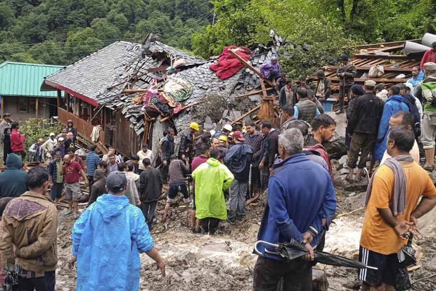 Rescue officials and others during a rescue operation at an affected area of Rajvan village following a cloudburst, in Mandi district, Thursday, Aug. 1, 2024.