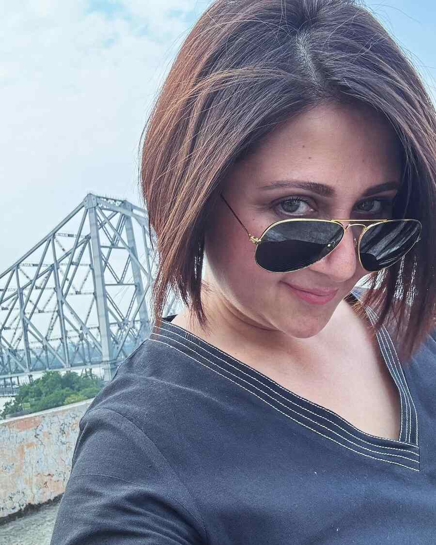 Peach perfect — pink shades come in many variations. While a classic pink, Barbiecore (‘rani colour’ in Bengali) or nude is essential, a peachy lipstick is just as important. It also serves as a cheek tint and cream eyeshadow and adds a finishing touch to a dewy makeup look. Tip: On humid days, take your pick of cream-based peach tints depending on your skin type and whether you will be spending time indoors or outdoors