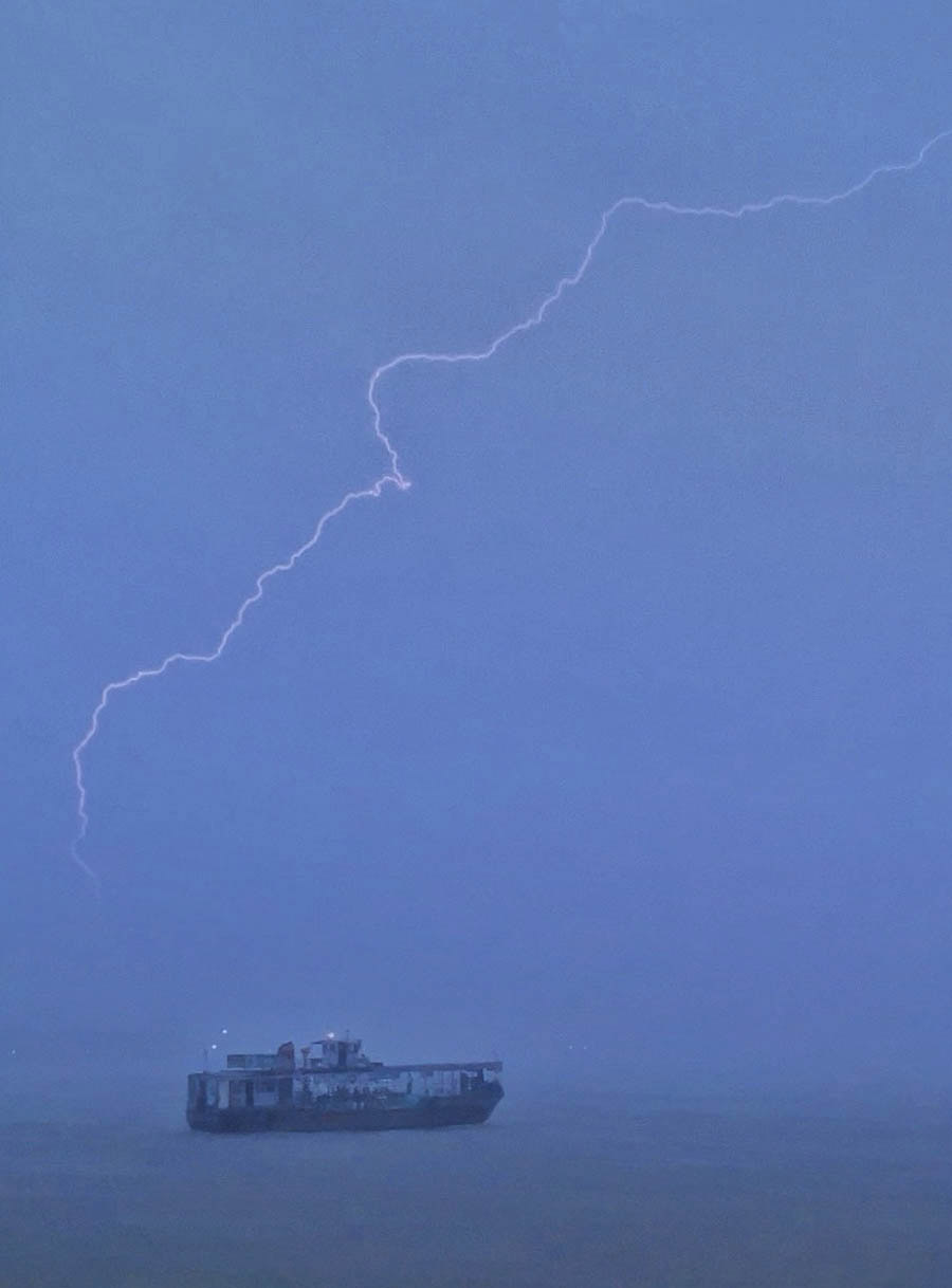 A streak of lightning across the sky as captured from Ahiritola Ghat in north Kolkata on Friday evening 