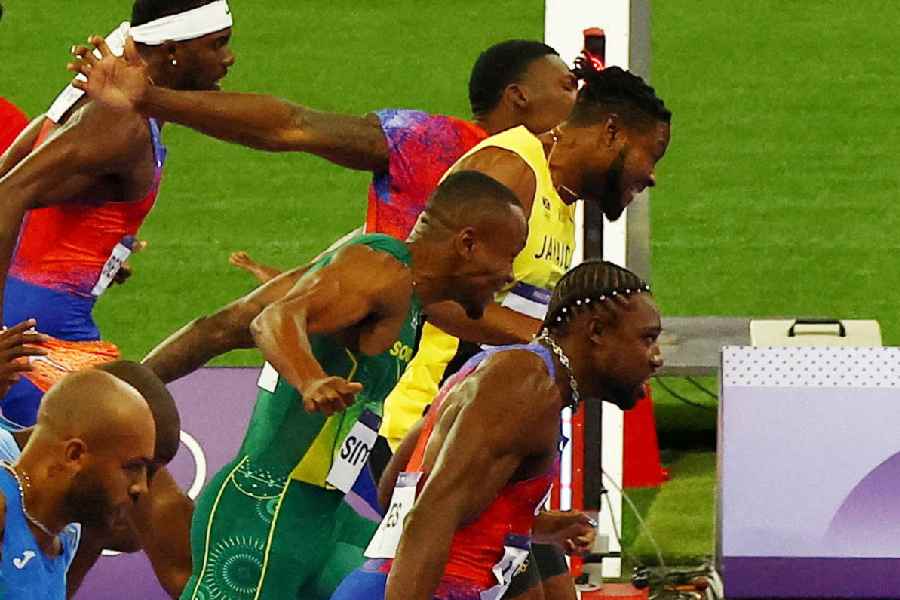 Noah Lyles of United States crosses the line to win gold