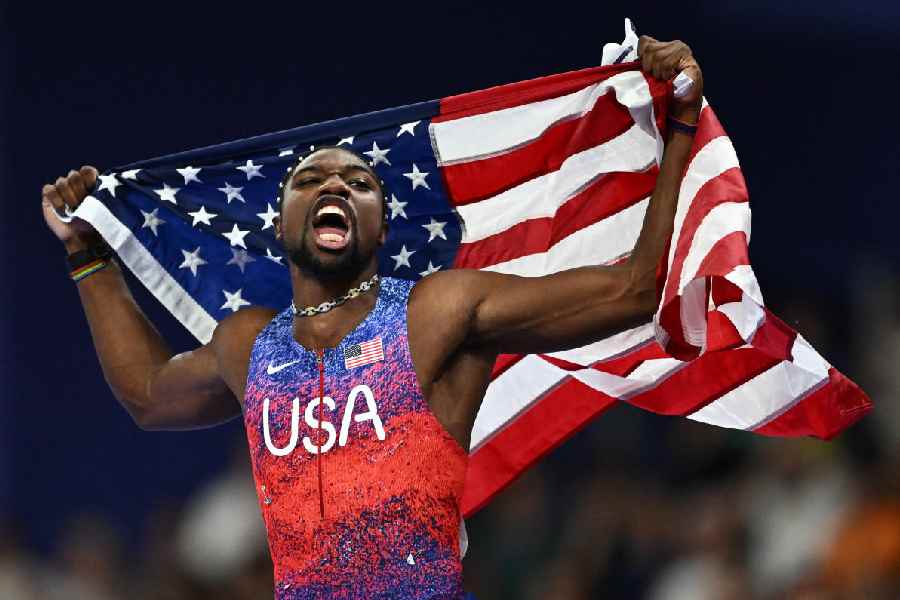 Noah Lyles of United States celebrates after winning gold