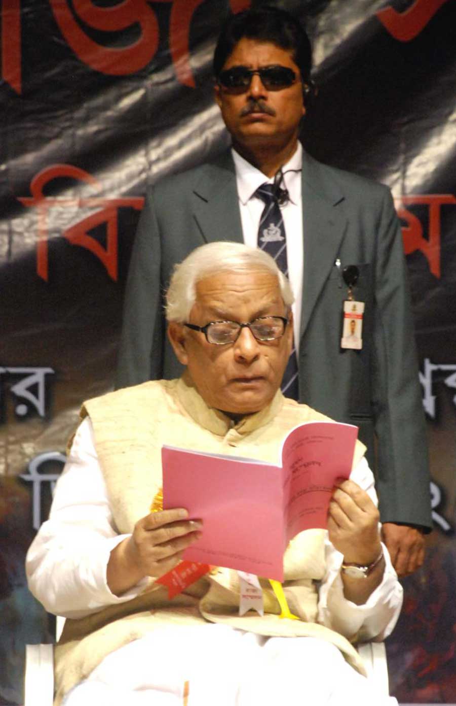 Chief Minister Buddhadeb Bhattacharjee leafing through a book at the 14th state conference of the coordination committee of the unions and associations of central government employees at Art Gallery auditorium in Jalpaiguri.
