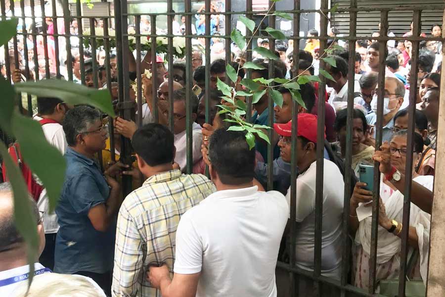 Crowd outside Alimuddin Street CPM office