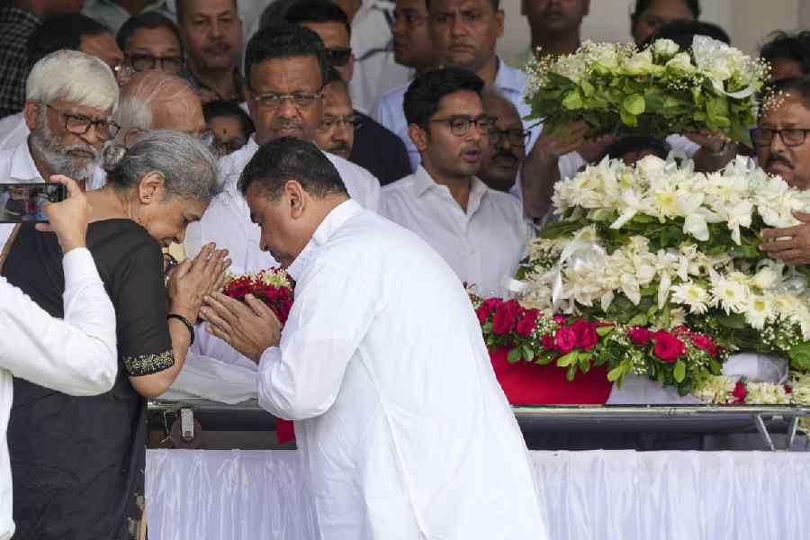 Leader of Opposition in West Bengal Assembly Suvendu Adhikari greets Meera Bhattacharjee, wife of Buddhadeb Bhattacharjee, after paying tribute to former West Bengal chief minister Buddhadeb Bhattacharjee, at West Bengal Legislative Assembly, in Kolkata, Friday, Aug. 9, 2024
