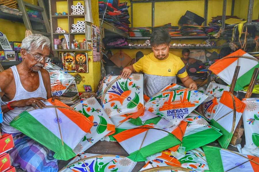 Artisans make an array of kites in saffron, white and green at a shop in Bowbazar on Friday