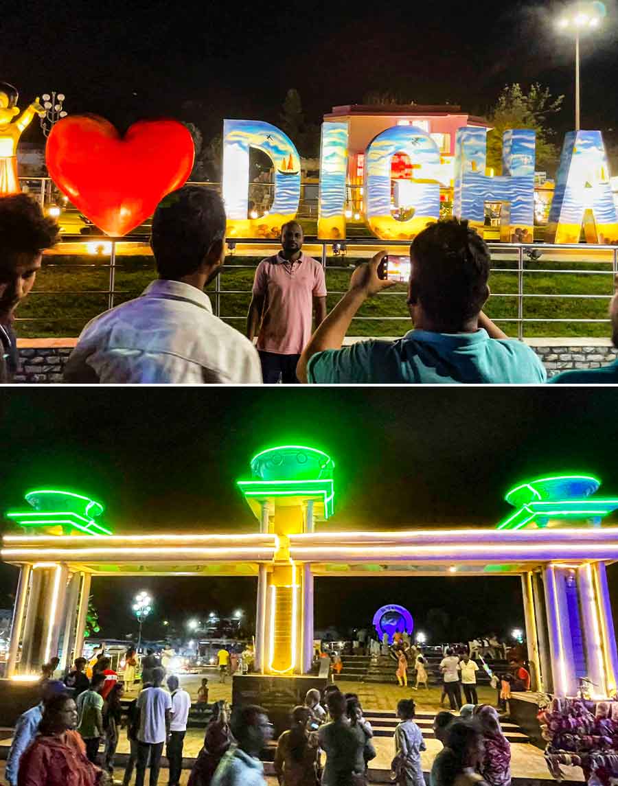 As day turns to night, the shore buzzes with activity as holidaymakers roam around, enjoying the cool evening breeze and exploring landmarks like the Biswa Bangla Gate