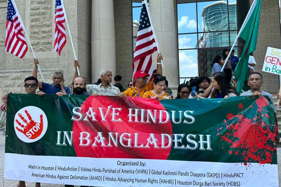 People stage a protest over the violence against minorities in Bangladesh, in Houston.