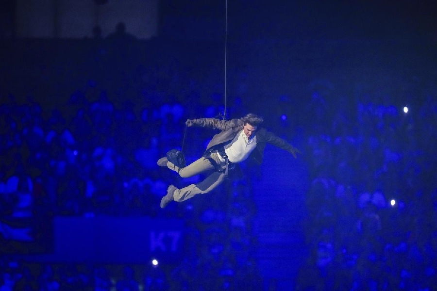 Tom Cruise is lowered on the Stade de France during the 2024 Summer Olympics closing ceremony, Sunday, Aug. 11, 2024, in Saint-Denis, France