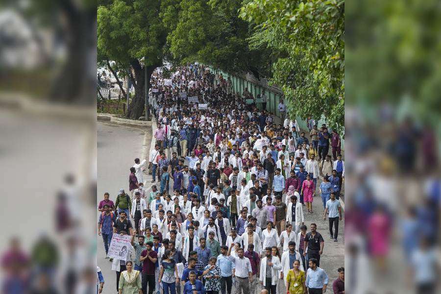 Doctors protest against the sexual assault and killing of a postgraduate trainee doctor in Calcutta, in New Delhi, Monday, Aug. 12, 2024.