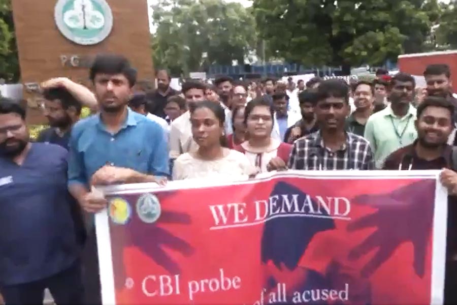Doctors and medical students hold protest over the death of a trainee doctor in Calcutta's RG Kar Medical College in Chandigarh