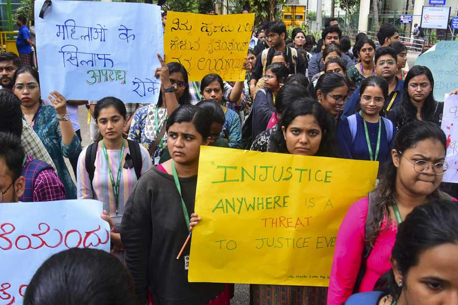 Resident doctors protest against the sexual assault and killing of a postgraduate trainee doctor in Kolkata, in Bengaluru, Monday, Aug. 12, 2024