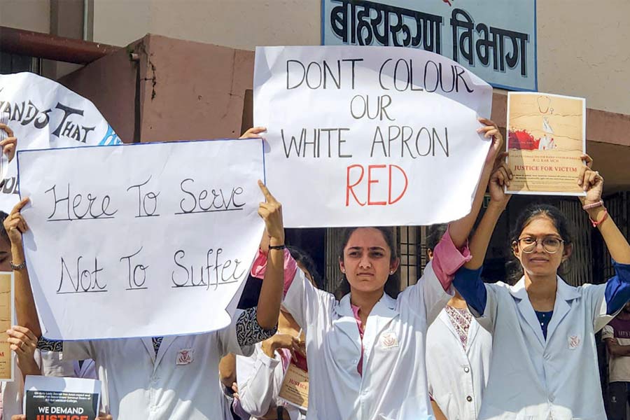 Doctors of Government Medical Collage and Hospital (GMCH) stage a protest against the rape and killing of a Calcutta based post-graduate trainee doctor, in Nagpur, Tuesday, Aug. 13, 2024