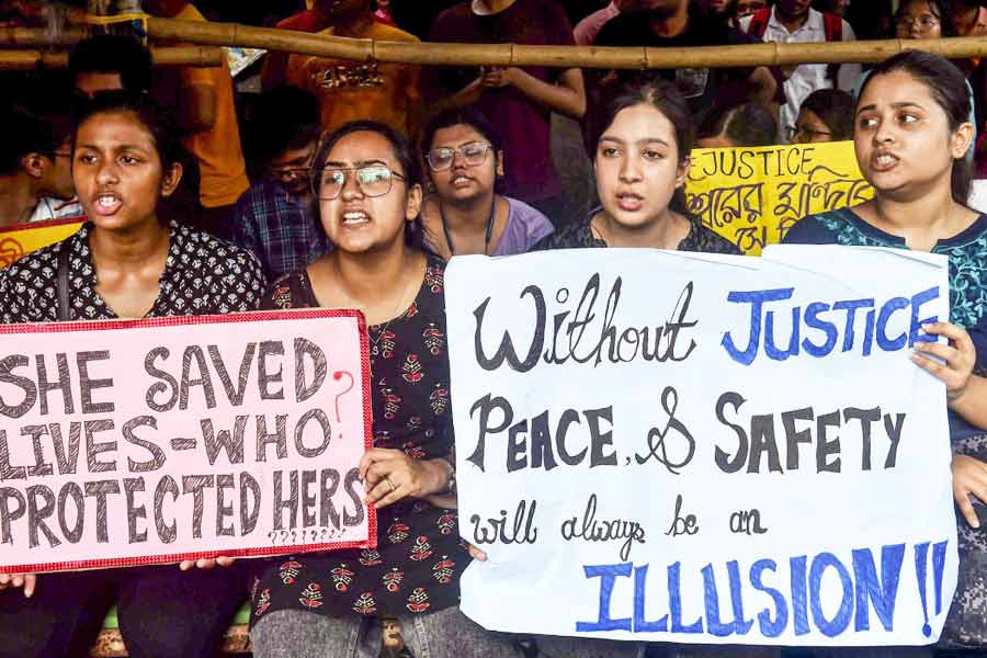 Resident doctors stage a protest against the sexual assault and murder of a postgraduate trainee doctor at RG Kar Medical College & Hospital, in Calcutta, Tuesday, Aug. 13, 2024