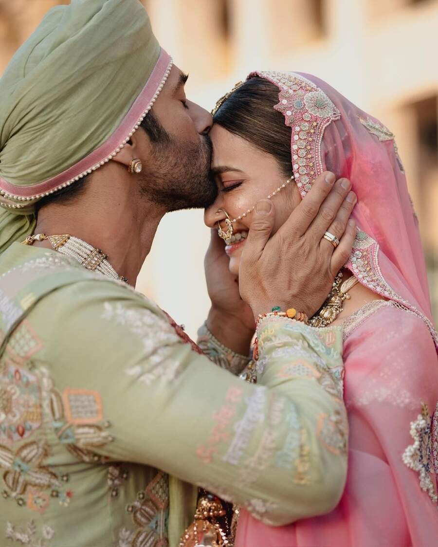 While Pulkit donned a four-piece pista-green angarakha adorned with Shiv Gayatri mantra, Kriti looked stunning in a pink lehenga embroidered with zari sequins and floral motifs. The Fukrey actor planted a kiss on his bride’s forehead at their pastel-themed wedding. Ali, who joked about clicking the picture on his camera, called it “the photo of the year” in his note. 