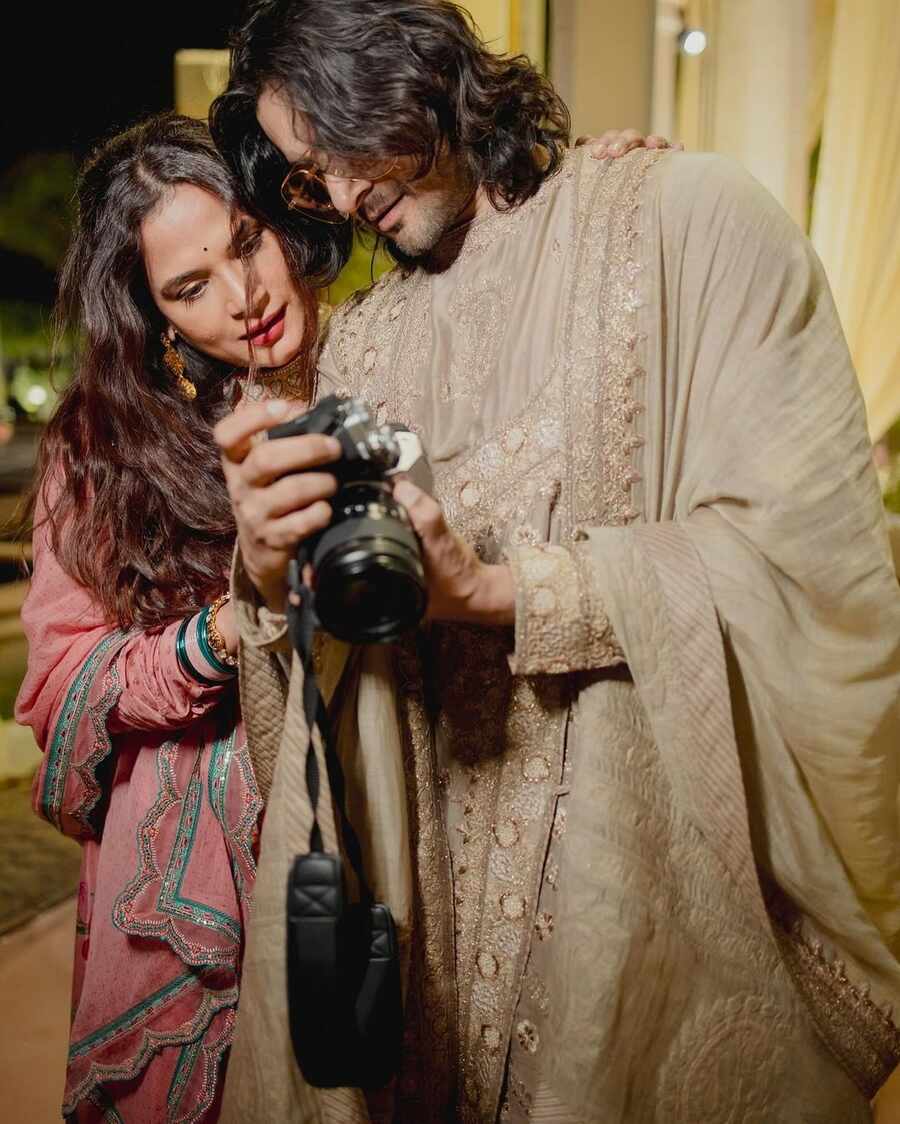 “Richa and me observing all the shots of the wedding because we were the ultra secret wedding photographers who were hired as NINJAS...even the real photographers didn't know we were in stealth mode acting as ‘friends of the couple’”, Ali quipped about a picture of him and Richa gazing in awe at a photo taken on his camera. 