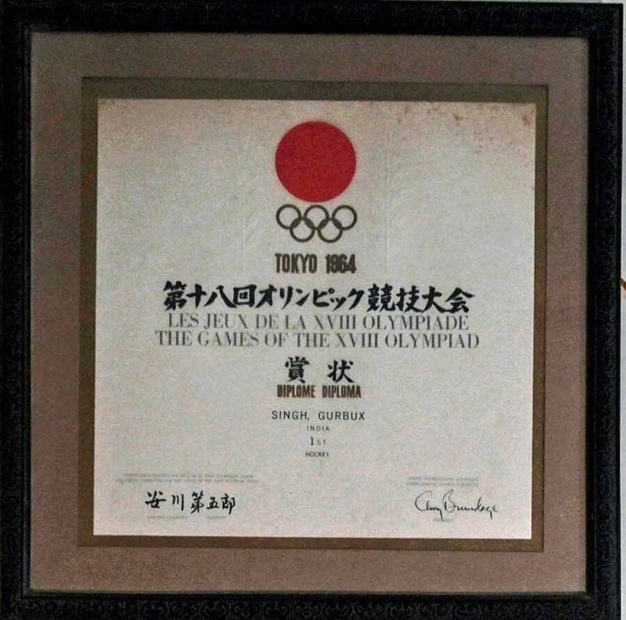 An Olympic medal symbolises an athlete’s victory on the most coveted stage, but did you know that along with the medals, athletes are also given certificates declaring them to be an Olympic champion. A tradition that is carried forward to this day, the Olympic medalists are given individual certificates separately and never on the podium. Gurbux Singh’s gold medal certificate from Tokyo 1964 hangs proudly on his wall