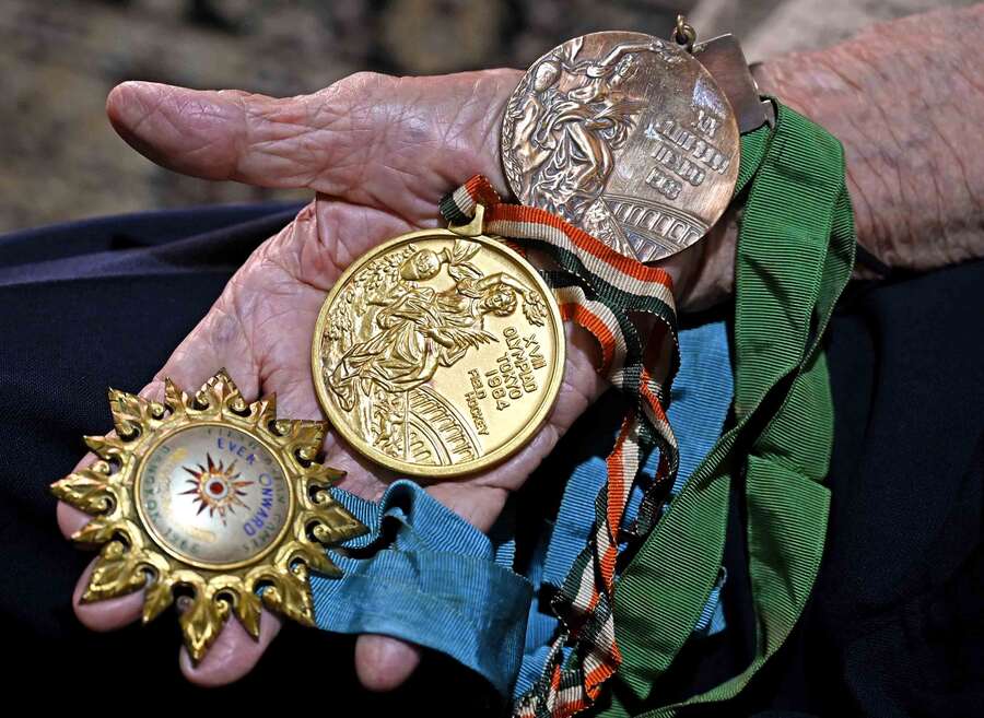 Laurels on the palm of a champion. With his Asian Games 1966 Gold medal, the first for the Indian field hockey team and his two Olympics medals. Notice that the Gold medal from Tokyo 1964 is thicker and has a rim around it in comparison to the Bronze medal from Mexico 1968. The Bronze medal is indeed thinner and lighter than the gold