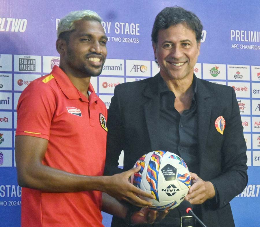 East Bengal FC head coach Carles Cuadrat and player Nandhakumar Sekar at a news meet during during the AFC Champions League 2 preliminary stage play-off at Salt Lake Stadium on Tuesday 