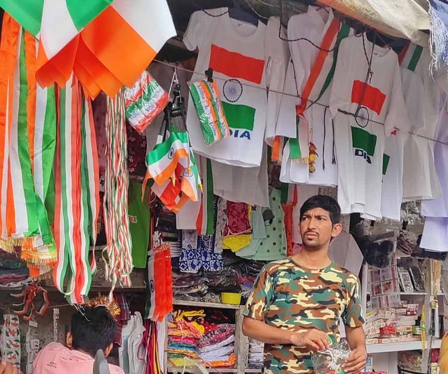 Flags and T-shirts in saffron, white and green on sale in north Kolkata on Wednesday ahead of Independence Day 