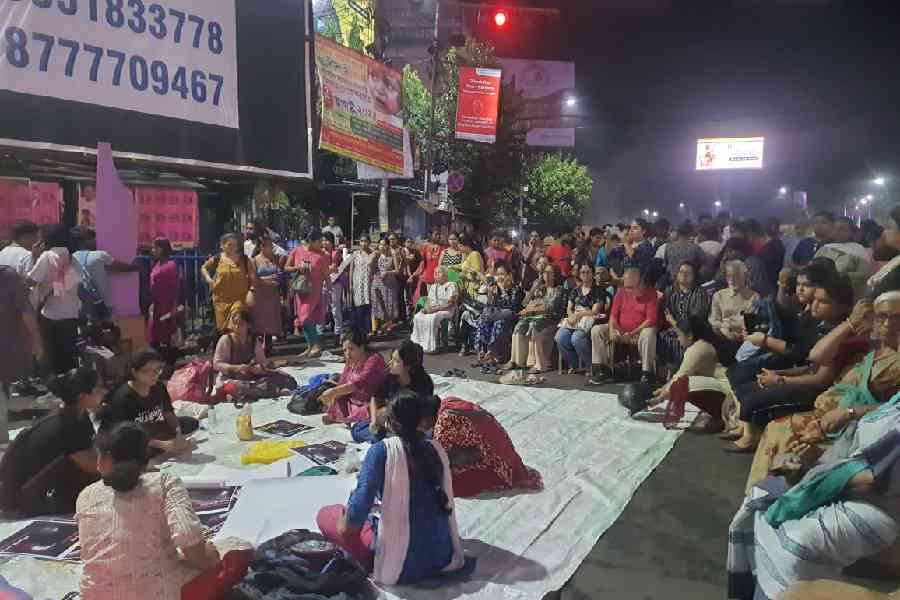 Local residents in Kolkata’s Rashbehari set up placards banners for the night ahead
