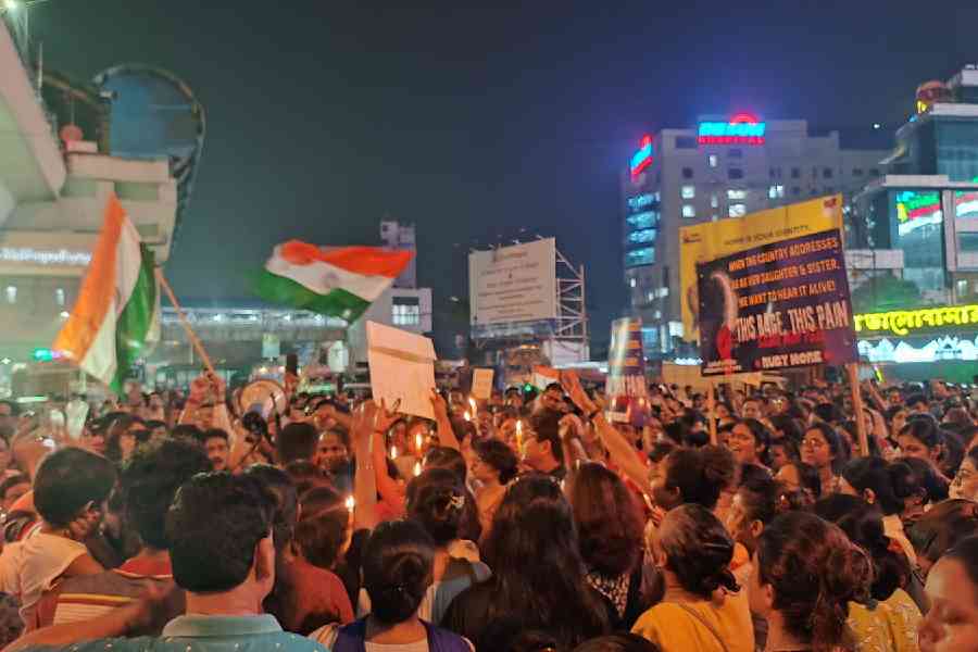 Protesters raise slogan at Ruby crossing, one of the busiest junctions of the city