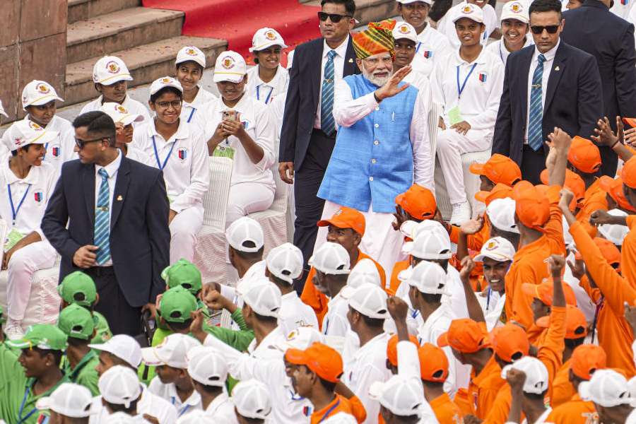 Prime Minister Narendra Modi greets children at the Red Fort on 78th Independence Day, in New Delhi, Thursday, Aug. 15, 2024. 