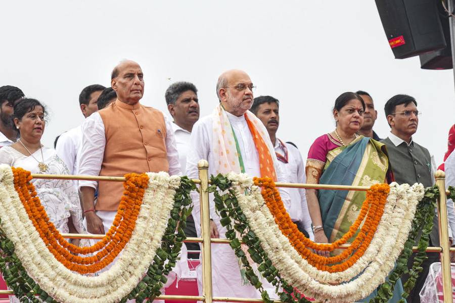 Union Home Minister Amit Shah, Union Defence Minister Rajnath Singh, Union Minister Nitin Gadkari and others stand during the national anthem at the Red Fort on 78th Independence Day, in New Delhi, Thursday, Aug. 15, 2024.