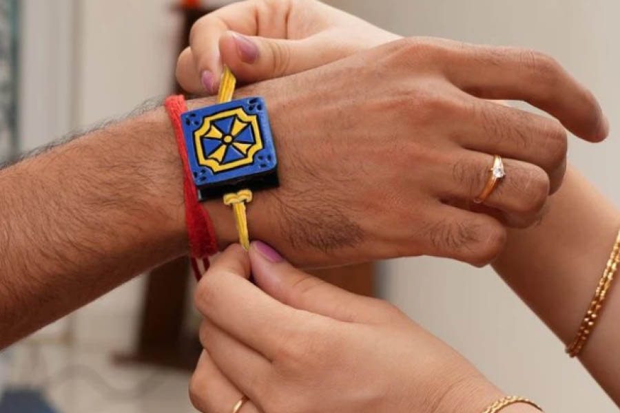 The secret photo terracotta rakhi from Oyehappy is a unique option