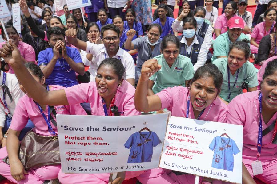 Nursing staff stages a protest amid the 24-hour nationwide strike called by the Indian Medical Association (IMA) demanding justice for the woman doctor who was allegedly raped and murdered at Calcutta's R G Kar Medical College and Hospital, in Bengaluru, Saturday, Aug. 17, 2024.