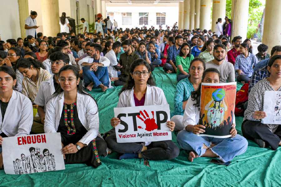 Resident doctors protest against the alleged rape and murder of a Calcutta based trainee doctor, in Ahmedabad, Saturday, Aug. 17, 2024.