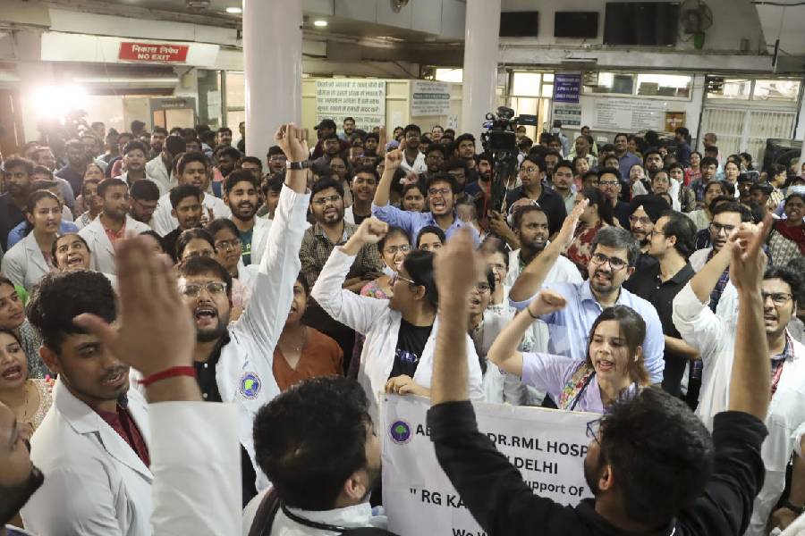 Doctors and staff of RML Hospital stage a protest demanding justice for the woman doctor who was allegedly raped and murdered at Calcutta's R G Kar Medical College and Hospital, in New Delhi, Saturday, Aug. 17, 2024.