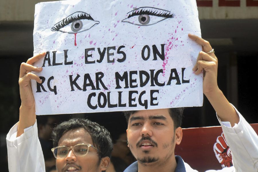 Junior doctors of Rajendra Institute of Medcial Science (RIMS) protest against the alleged rape and murder of a Calcutta based trainee doctor, in Ranchi, Saturday, Aug. 17, 2024.