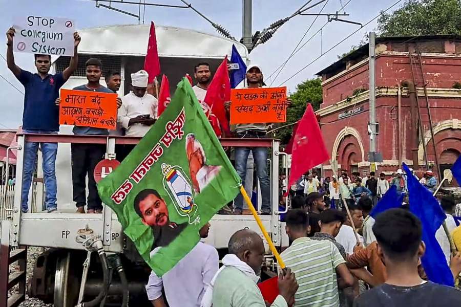 Bhim Army supporters block railway tracks in support of the Bharat Bandh call over the recent Supreme Court ruling on SC/ST reservations, in Arrah, Thursday, Aug. 21, 2024.